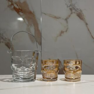 hielera de calavera mas 2 vasos whiskeros de calavera color dorado