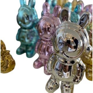 estatuilla  decorativa de ceramica con diseño de astronauta