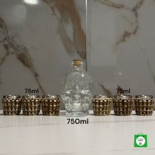 licorera de 750ml calavera de color transparente mas 6 copas metalicas de calavera